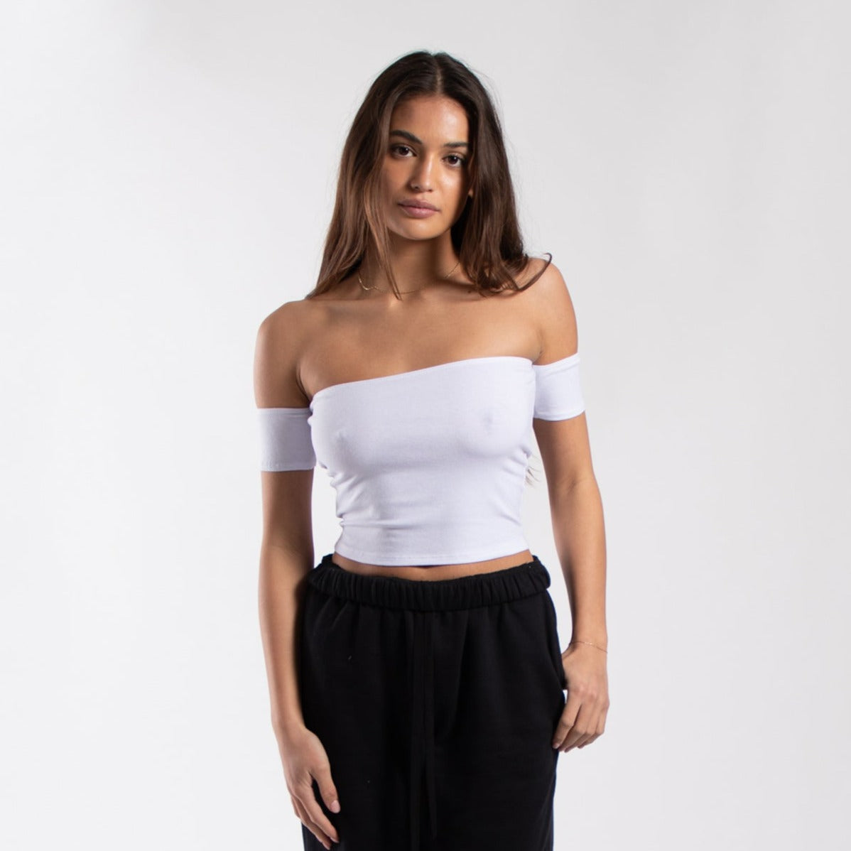 Women's off-shoulder cropped tee from POS Wholesale, stylish crop top featuring a relaxed fit and trendy design.
