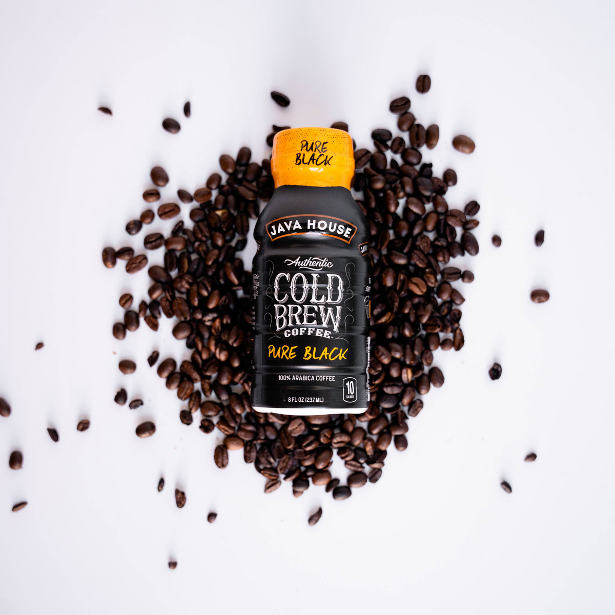 Java House Cold Brew 8oz bottle featuring sleek black label and dark coffee liquid inside.