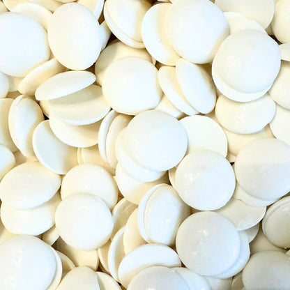 White vanilla-flavored chocolate coating and melting wafers by Candy In Bulk in a large bulk bag, perfect for candy making.