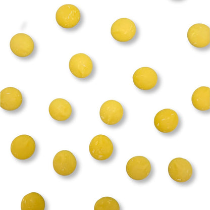 Yellow vanilla-flavored Candy In Bulk Merckens chocolate coating and melting wafers in a bulk value bag, ideal for candy making and decorating.