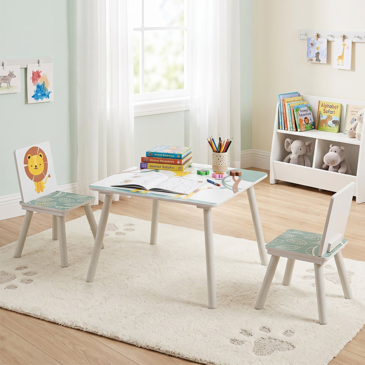 Kids furniture set with a table and two chairs featuring colorful animal pattern designs, ideal for children's playroom or bedroom.