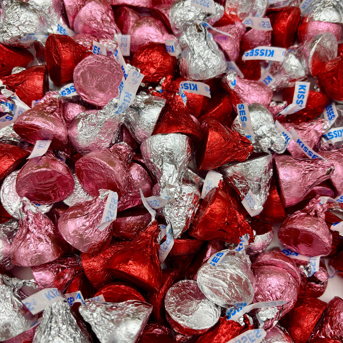 Hershey’s Kisses Milk Chocolate Valentine’s Edition in a bulk Candy In Bulk bag, showing the signature chocolate kisses with foil wrappers.