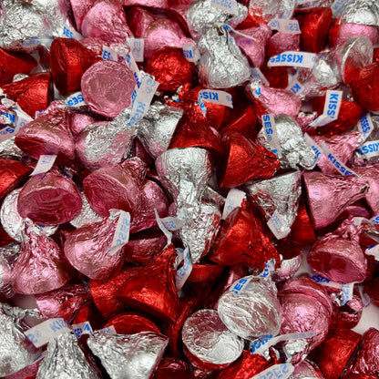 Hershey’s Kisses Milk Chocolate Valentine’s Edition in a bulk Candy In Bulk bag, showing the signature chocolate kisses with foil wrappers.