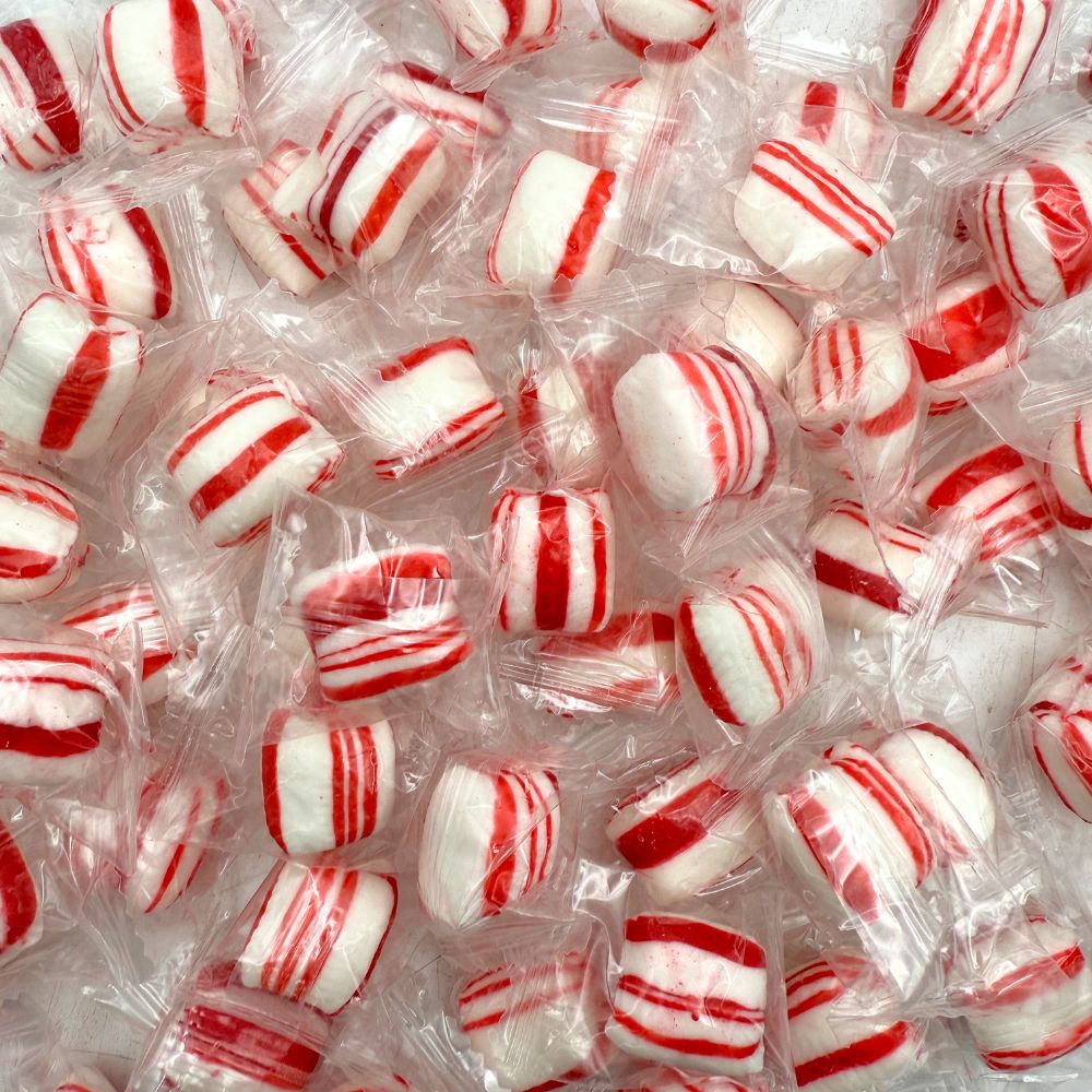 Peppermint Twist Hard Candy from Candy In Bulk, individually wrapped in a bulk bag, showing red and white striped candies.