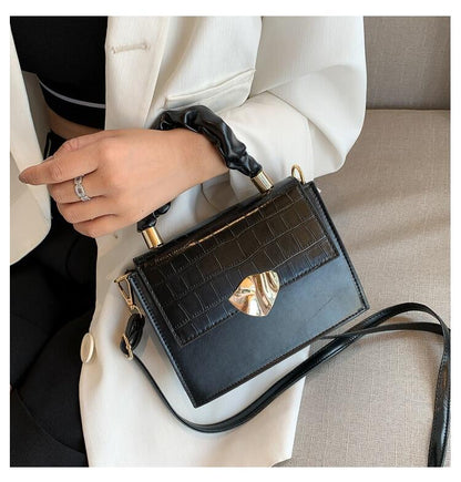 BACKUPMYFILESNOW® designer women's crossbody handbag with a stylish stone pattern and compact, sleek design.