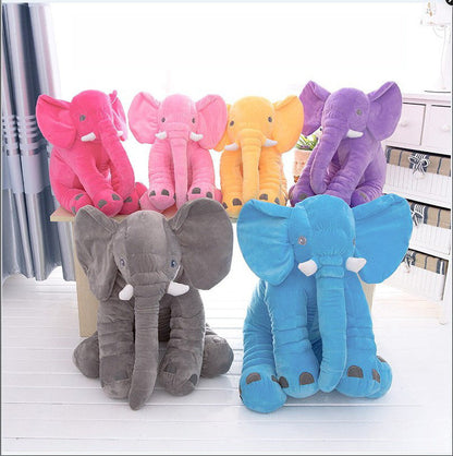 Soft comfort elephant plush toy with leather shell, designed as a child’s sleeping pillow beside a baby