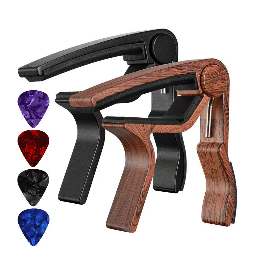 Portable metal guitar capo tuning clip for home use, silver finish.
