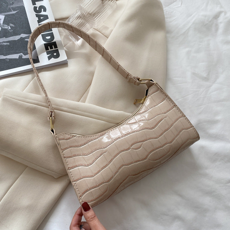 BackUpMyFilesNow® women's small shoulder and underarm bag with simple design, featuring a compact shape and adjustable strap.