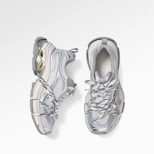Silver designer dad-style athletic casual shoes in a chunky low-top sneaker design