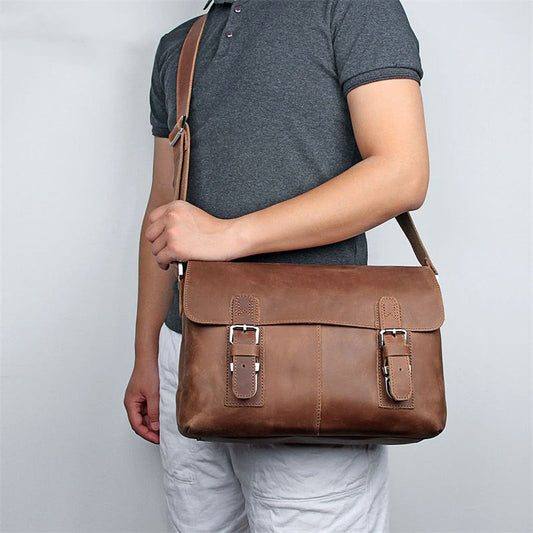 Vintage leather crossbody bag for men in brown with adjustable shoulder strap and multiple compartments