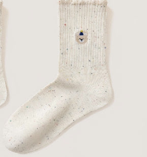 Women's embroidered ruffle-ankle socks in white with delicate floral details