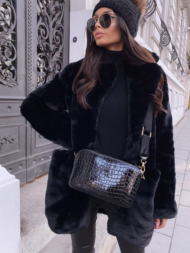 Women’s long sleeve lapel faux fur coat in a solid color