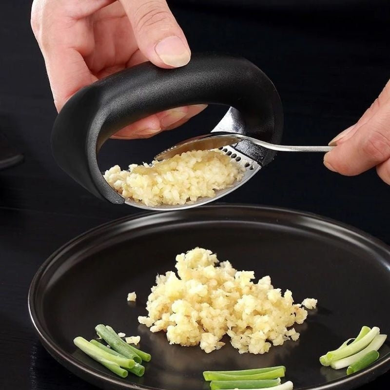 Stainless steel manual garlic press and masher with curved handle for kitchen use