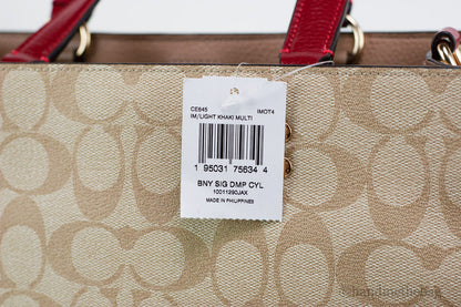 Coach Dempsey Medium Lunar New Year Rabbit Carryall Tote in leather with festive rabbit design and top handles for stylish carrying.