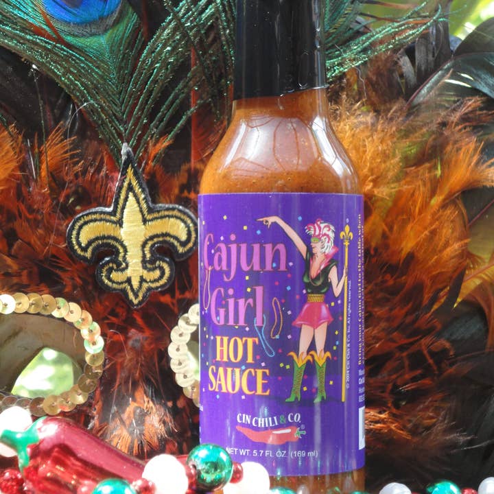 Cinderosa Ranch Cajun Girl Louisiana-Style Hot Sauce bottle with label, showcasing spicy hot sauce for flavorful dishes.