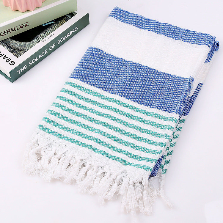 Striped cotton beach towel, 100x180cm, laid flat with alternating color bands