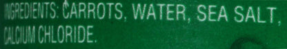 Cans of Del Monte sliced carrots in an 8.25-ounce prepackaged container, stacked in a retail display.