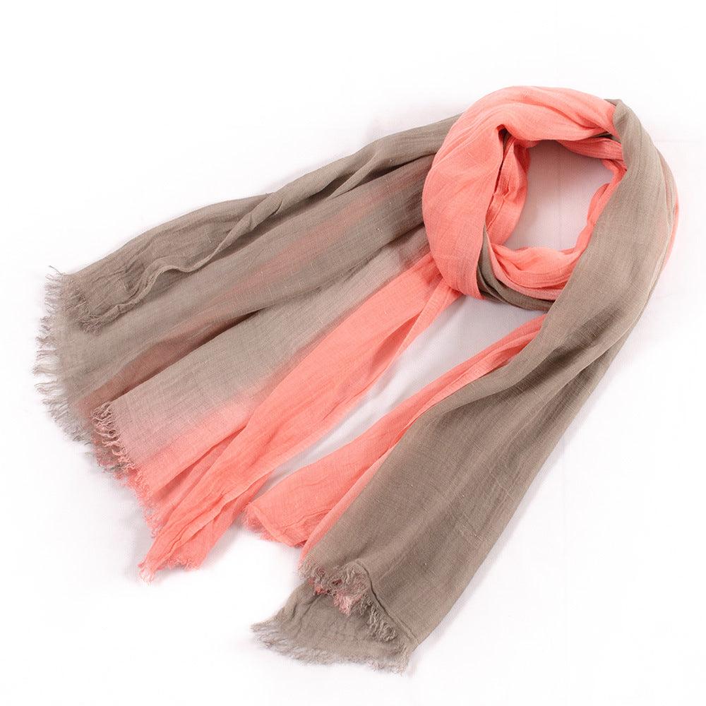 Large soft warm cotton tassel scarf laid flat in a neutral color