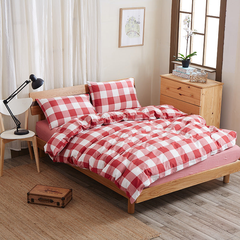 Pure cotton four-piece bed sheet set in a soft, durable fabric for comfortable bedroom bedding