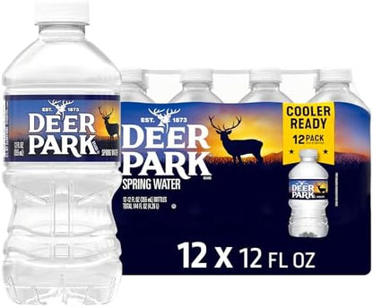 Deer Park natural spring bottled water, 12 fl oz, 12-pack, clear plastic bottles with blue caps and Deer Park label on the front.