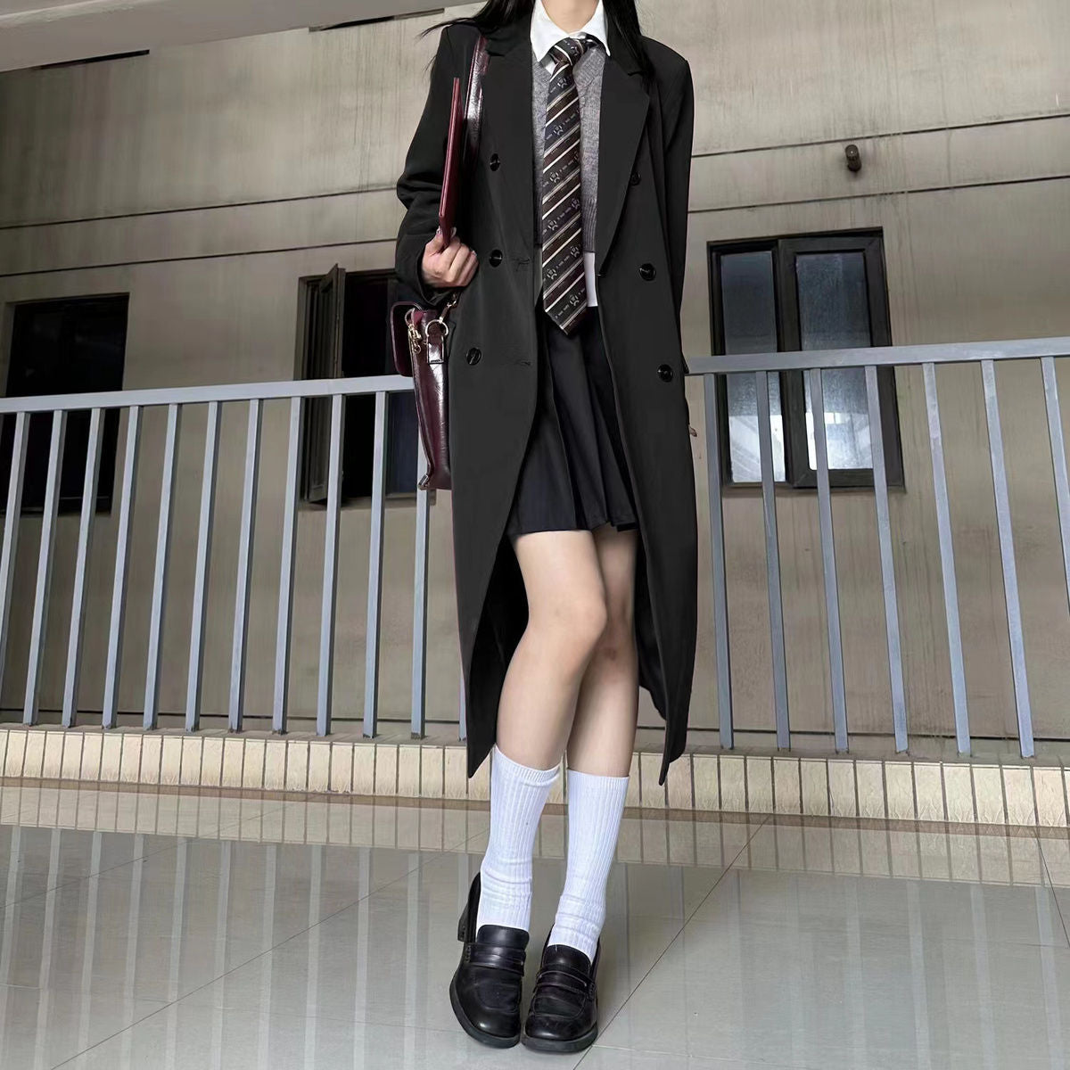 Black long suit trench coat for women, featuring a tailored fit and classic lapels for spring and autumn wear