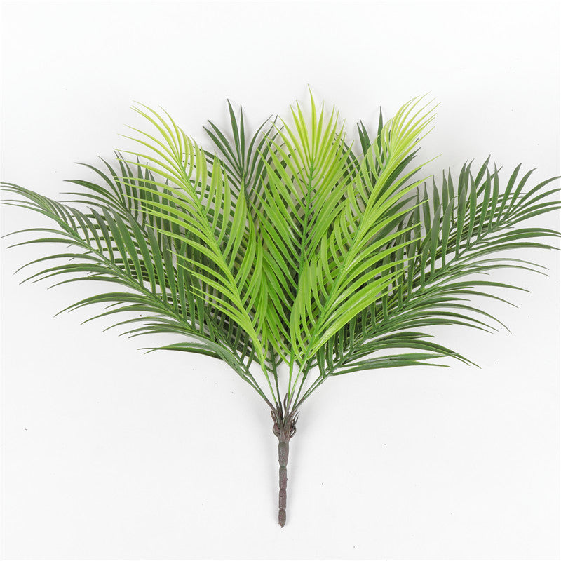 Artificial palm tree leaf green plastic plant in a pot
