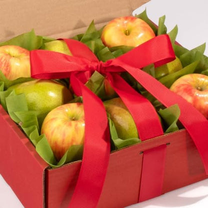 Organic fruit gift basket featuring fresh Honeycrisp apples and green D’Anjou pears, hand-packed with a ribbon, by A Gift Inside.