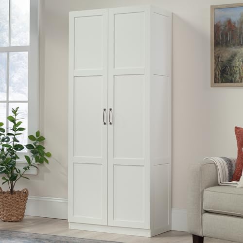 Sauder white storage cabinet with pantry shelves, ideal for organizing snacks and kitchen essentials.