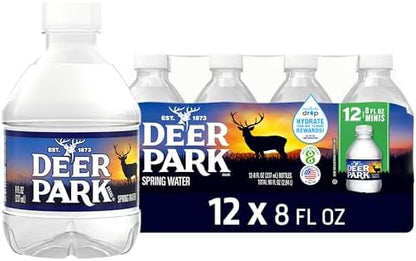 Deer Park natural spring bottled water in 8 fl oz mini bottles, 12-pack, showing clear water in plastic bottles.