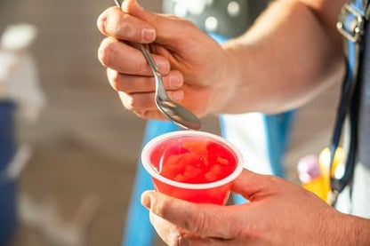 Dole Fruit Bowls Peaches in 4.3oz snack cups, 12-pack, showing ripe peach slices in clear fruit snack containers.