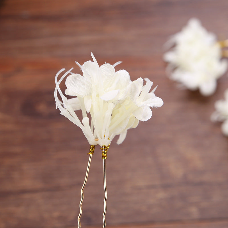 Handmade wreath headwear with intricate floral design, shown from the front