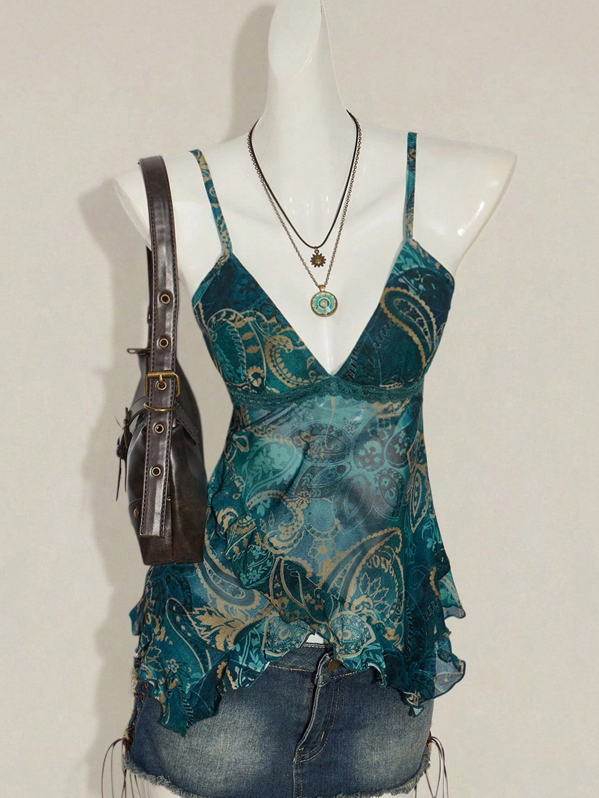 Floral-print figure-flattering mesh top with sheer fabric and fitted silhouette