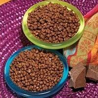 AmBari Nutrition chocolate mini crisps in a bowl, close-up view of crispy, chocolate-flavored snack pieces.