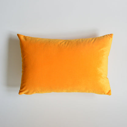 Velvet throw pillow for sofa in a soft, textured fabric and neutral color
