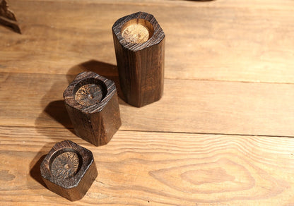 Solid wood candle holder with natural wood grain and carved designWinvalid