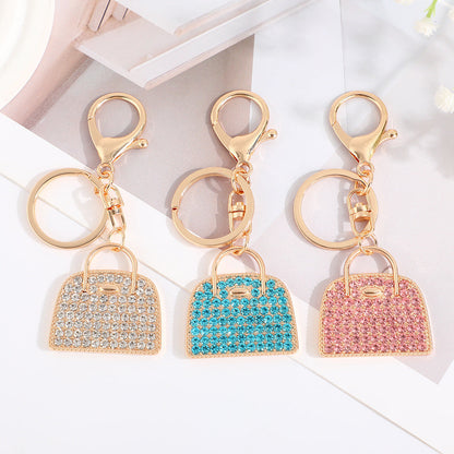 Minimalist diamond-studded handbag charm keychain in a creative design