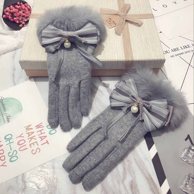Cute warm touch screen thickened gloves for cold weather, close-up view of soft insulated finger design