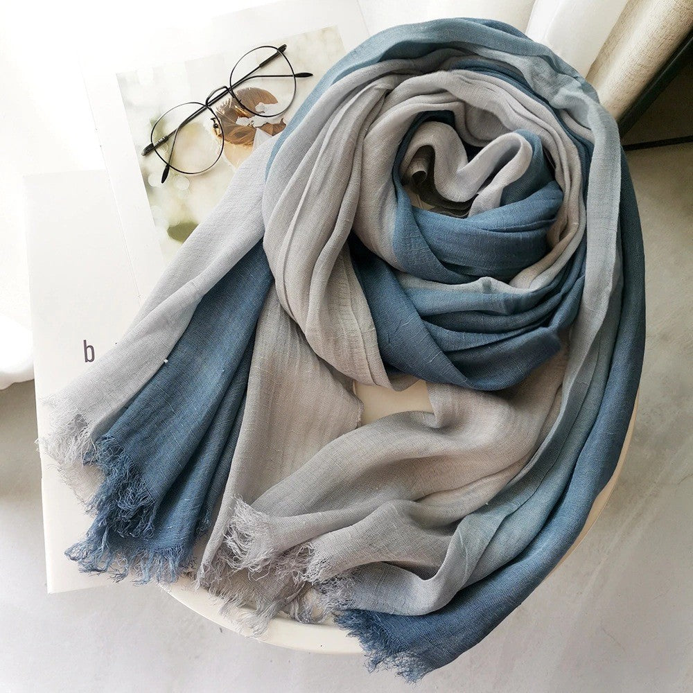 Large soft warm cotton scarf with tassel edges laid flat