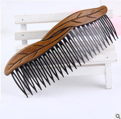 Retro fashion hair comb, decorative design with vintage-inspired details and smooth teeth.