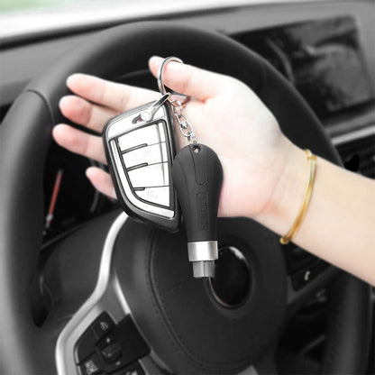 Mini emergency vehicle safety hammer with red handle and black metal tip draped in clear packaging