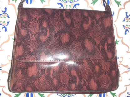 Handmade women's handbag with handles, featuring a stylish design and natural craftsmanship, perfect for everyday use.