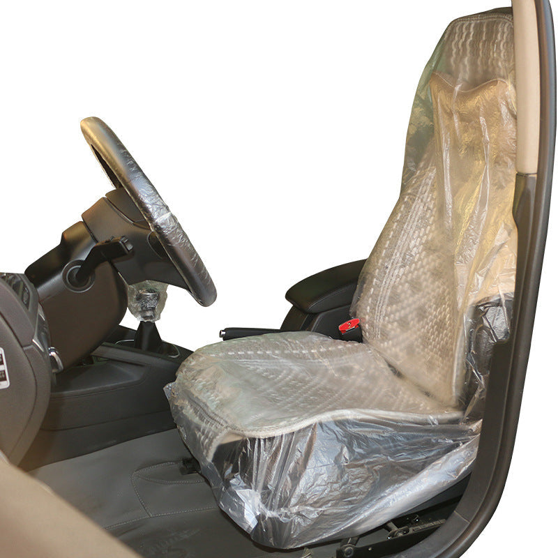 Disposable car repair seat cover for vehicle interiors, protective plastic seat cover displayed flat