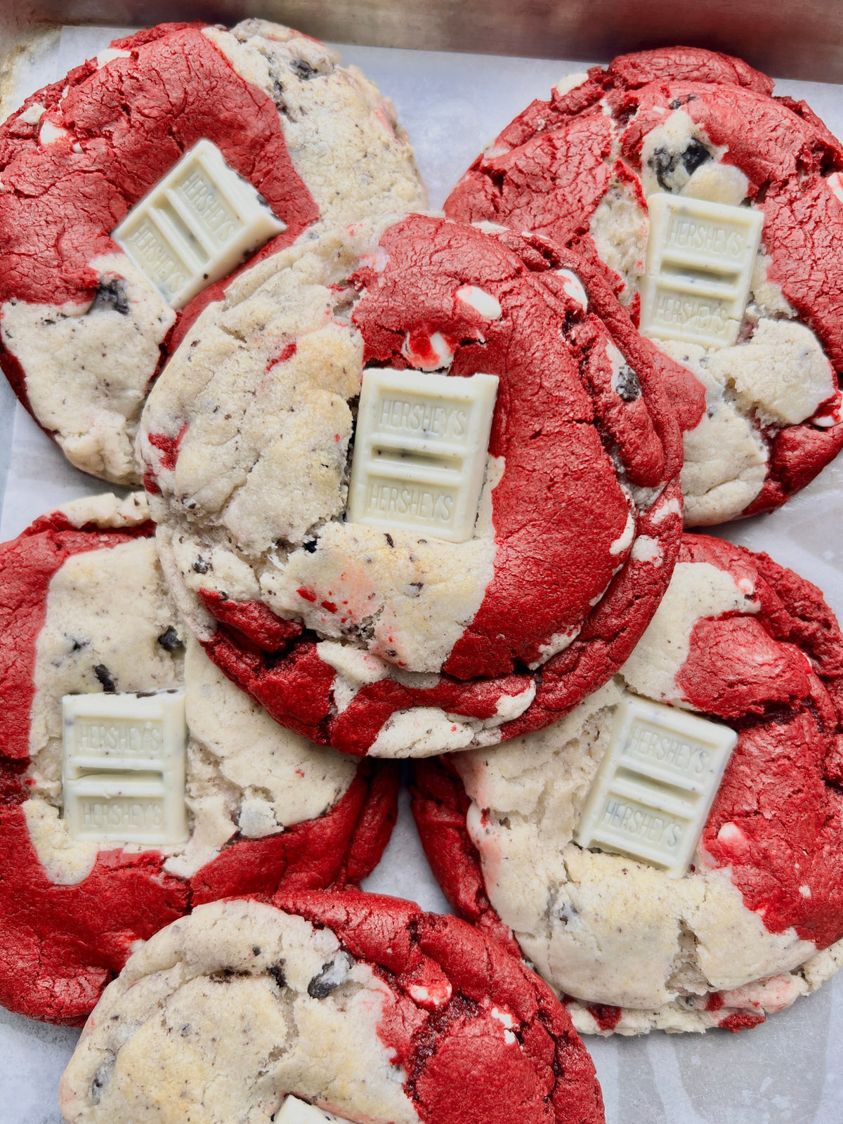Red Velvet Cookies & Cream dessert from Let's Get Baked Artisan Desserts, showcasing a rich, creamy treat with red velvet and cookie pieces