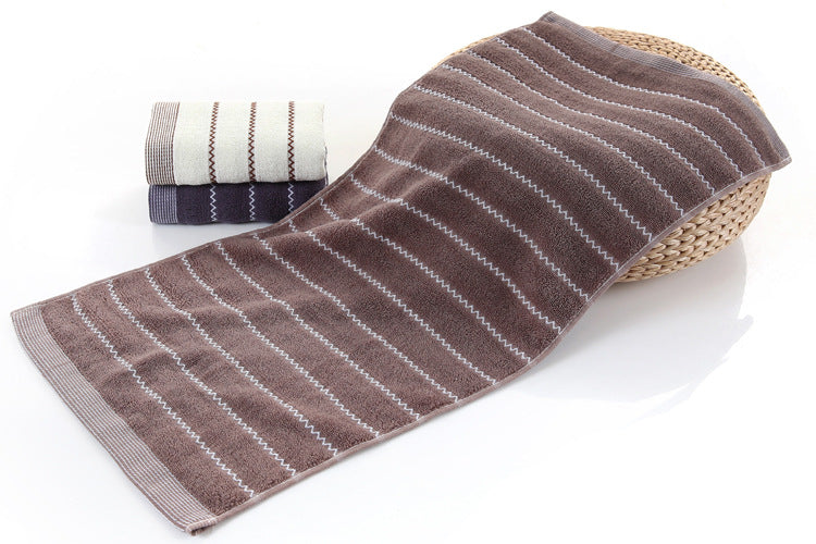 Cotton embroidered towel with detailed stitching and soft textured fabric against a clean background