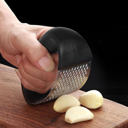 Stainless steel manual garlic press and masher with curved handle for kitchen use