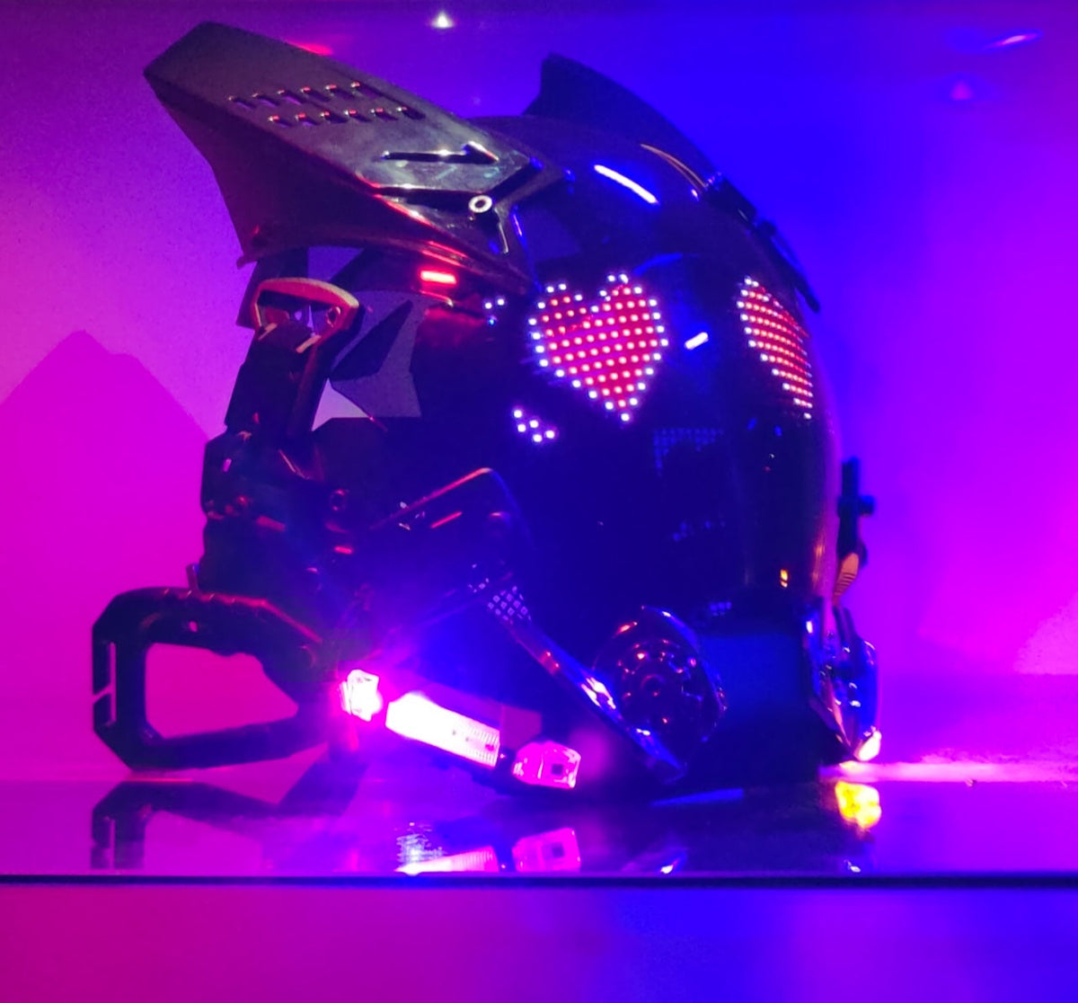 Luminous helmet mask with futuristic technology-inspired design, front view