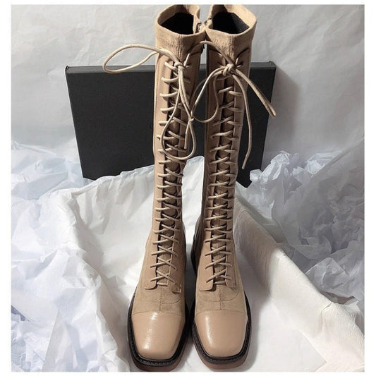 Stitched round-toe lace-up high-top women's boots in a classic ankle-high design