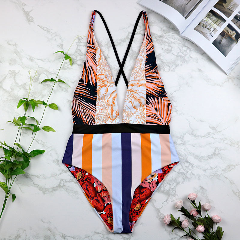 Black one-piece swimsuit with deep V neckline and sexy bikini-style design
