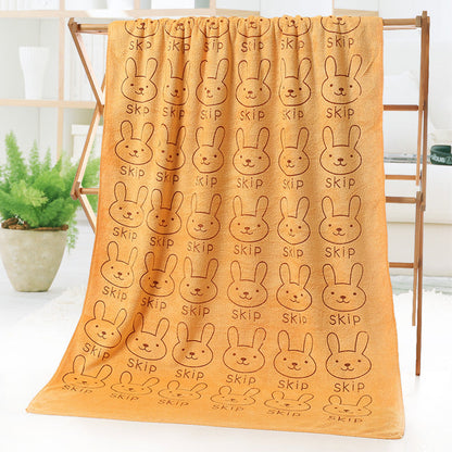 Cartoon print bath and beach towel displayed flat, soft terry fabric with colorful illustrated design