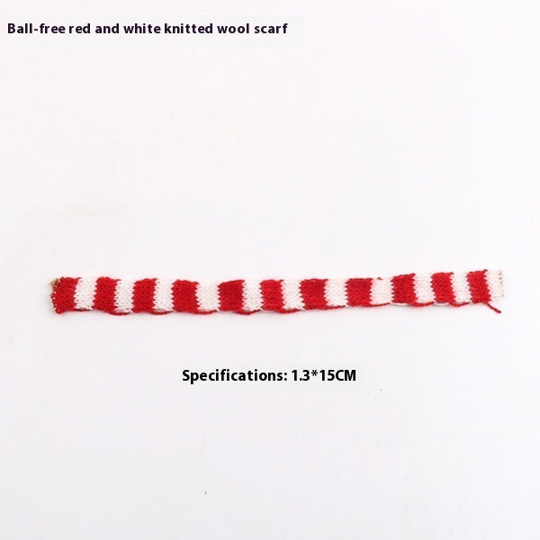 Mini Christmas scarf hat doll decoration in festive red and white attire, close-up view